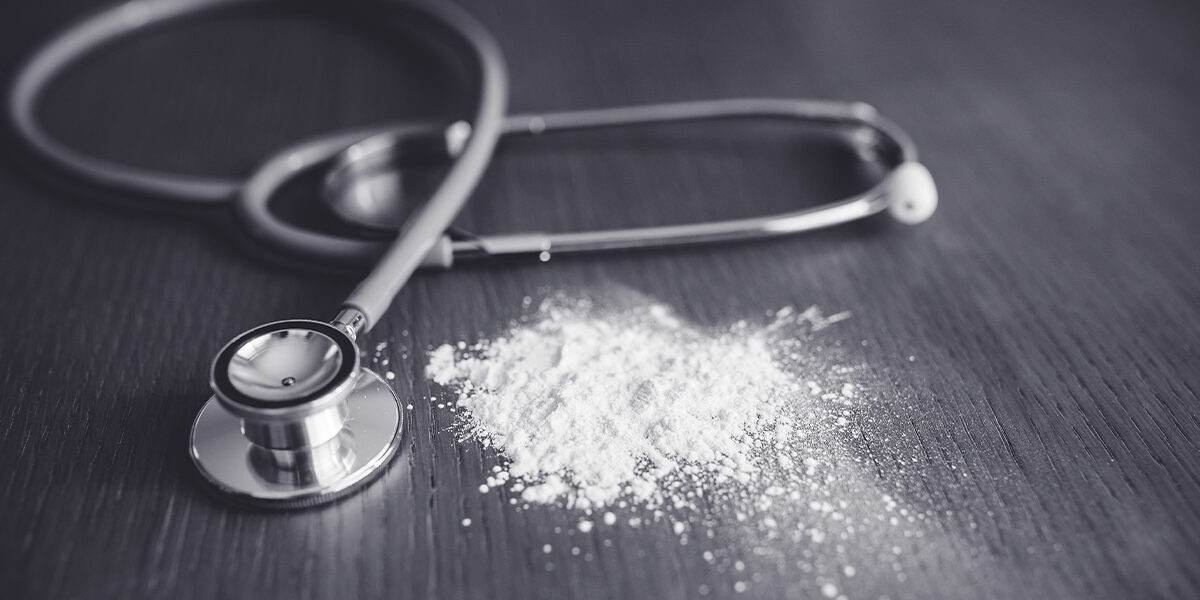 Talcum Powder Cancer Verdict Featured image showing a stethoscope on a table with a small pile of talcum powder