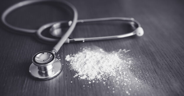Talcum Powder Cancer Verdict Featured image showing a stethoscope on a table with a small pile of talcum powder