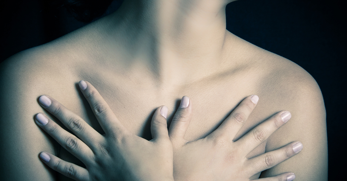 Allergan Allegedly Knew of Breast Implant Cancer Risks woman holding her chest