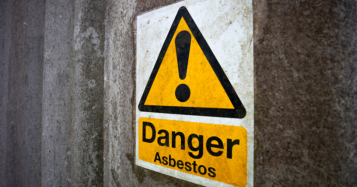 Baby Powder Lawsuit with Johnson and Johnson featured image showing a yellow and black danger asbestos sign on a concrete wall