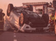 Reckless Driving Examples That Cause Accidents featuring a car or SUV flipped over on road with firefighter and ambulance nearby