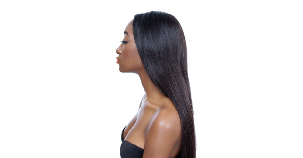 Chemical Hair Straightener and Relaxer Linked To Uterine Cancer featured image with beautiful African American Woman with straight dark hair with angry look on her face against blank white background